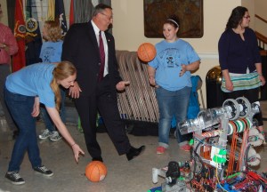 Governor LePage and Messalonskee High School students play with basketballs ejected by the school's robotics team, "Infinite Loop," which participated in the FIRST Robotics World Championship in St. Louis in April.
