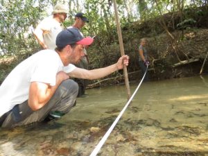 York students Gavin Fischer and Anna Schindler help develop a stream profile in the highland region of Taboco, Brazil.