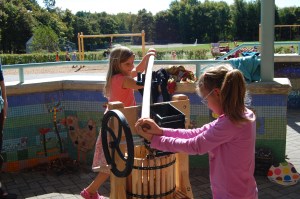 Mount Desert Elementary students Ivanna Dmitrieff (left) and Faith Reece press apples for cider during Harvest Lunch Week.
