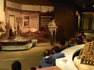 Joanna Torow, Maine State Museum's chief educator, provides information to students from Rangeley Lakes Middle School.