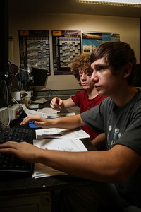Oxford Hills Technical School Pre-Engineering students Nicholas McNelly and Ian Lejonhud complete a computer simulation using programmable logic controllers.