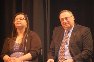 Michelle Zhang, Cony High School senior, takes the stage with Governor LePage.