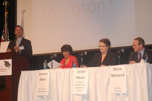Commissioner Stephen Bowen reads questions from the audience to the first panel of presenters at the Governor's Conference on Education.