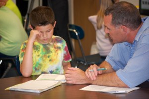 Fifth grade teacher Mike Louder provides one-on-one reading instruction to Austin Taylor at Canaan Elementary.
