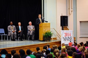 Commissioner Bowen announces Maine's Teacher of the Year to an auditorium full of students.