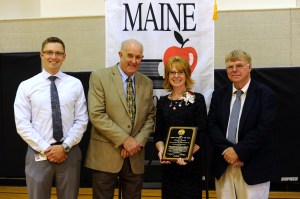 In a surprise all-school assembly Thursday at Skowhegan Area Middle School, longtime MSAD 54 special educator Jennifer Dorman was named the 2015 Maine Teacher of the Year. She is the second special education teacher ever honored with Maine’s top award for educator excellence. Pictured here: Skowhegan Area Middle School Principal Zachary Longyear, Maine Department of Education Commissioner Jim Rier, 2015 Maine Teacher of the Year Jennifer Dorman and MSAD 54 Superintendent Brent Colbry.