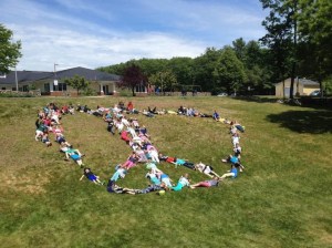 Coastal Ridge Elementary students form a peace sign