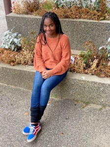 Computer Support Specialist student Ester Bassa sat for an outdoor photo during November mock interviews at the Adult Learning Center at the Longley Multipurpose Center.