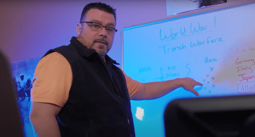 man standing in front of projector