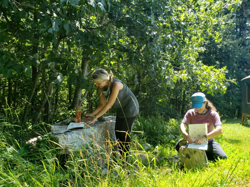 teachers working together outside, smiling