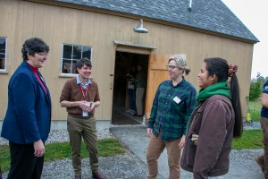 Volunteer Maine staff members speak with local Jacky Zarate