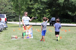 Representatives from Let’s Go! 5-2-1-0 Goes to Child Care doing activities with kids