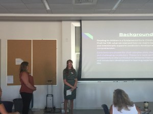 Educators standing up in front of training class