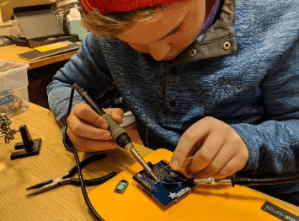 student wiring a circuit