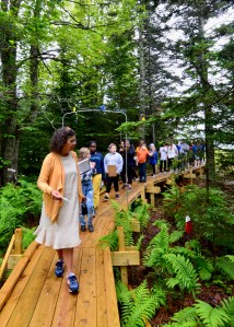 students walk on boardwalk