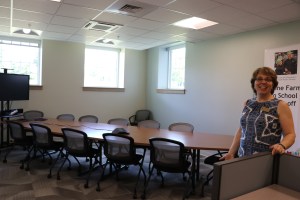 Maine DOE Child Nutrition staff member, Paula Nadeau stands in a new conference room at the DOE.