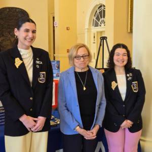 Governor Mills with students from DECA.