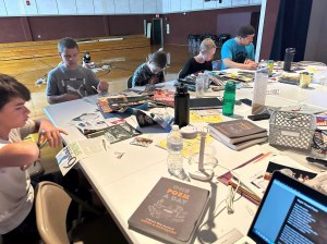 students sitting around a table working together