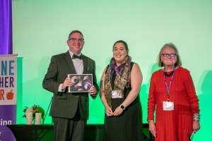 Representatives from ACTEM presenting 2024 Joshua Chard with an iPad.