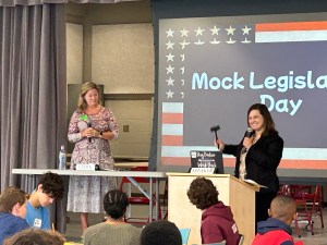 Dr. Holly Blair and Heather Anderson serving as speaker and clerk in the House Session portion of the day.