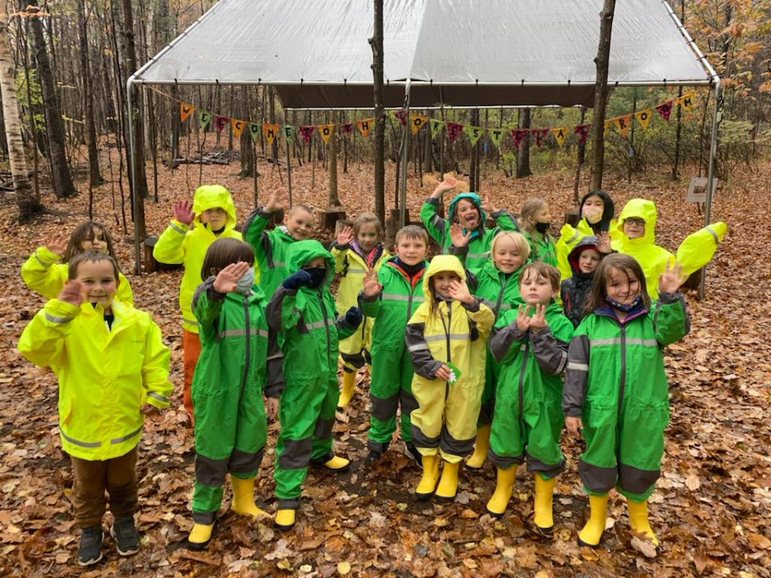 kids in raincoats outside