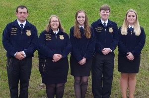 Vermont trainees (left two) and Maine trainees (right three) join each other in official FFA dress