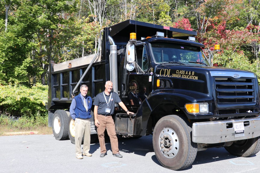 WRTC Director Todd Fields and Jeremy Kendall standing next to one of their CDL Driving Trucks.