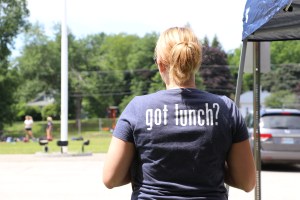 Woman with a t-shirt that says "Got Lunch?"