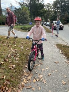 child sitting on bike