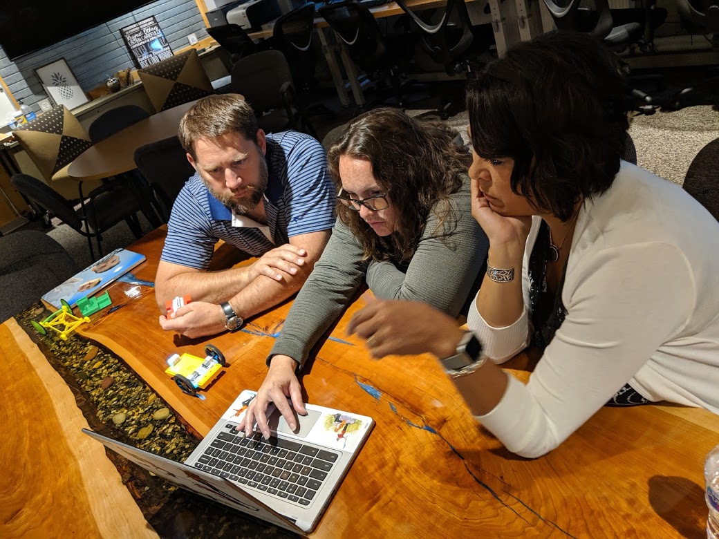 educators looking at a computer screen together