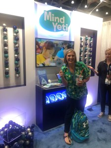 School counselor poses for picture at conference