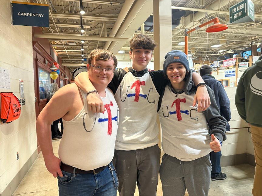 United Technology Center students [L to R] Dominic, John, and Joe attend SkillsUSA with homemade t-shirts rooting for their friend, Zach who is competing in the construction competition this year.