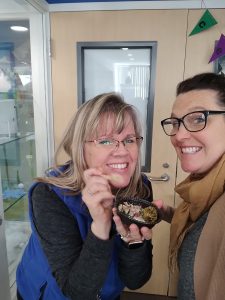 Principal Heather Wilson (left) and Kristel Anuszewski (right) enjoy Chef's Seaweed-ish Meatball recipe.