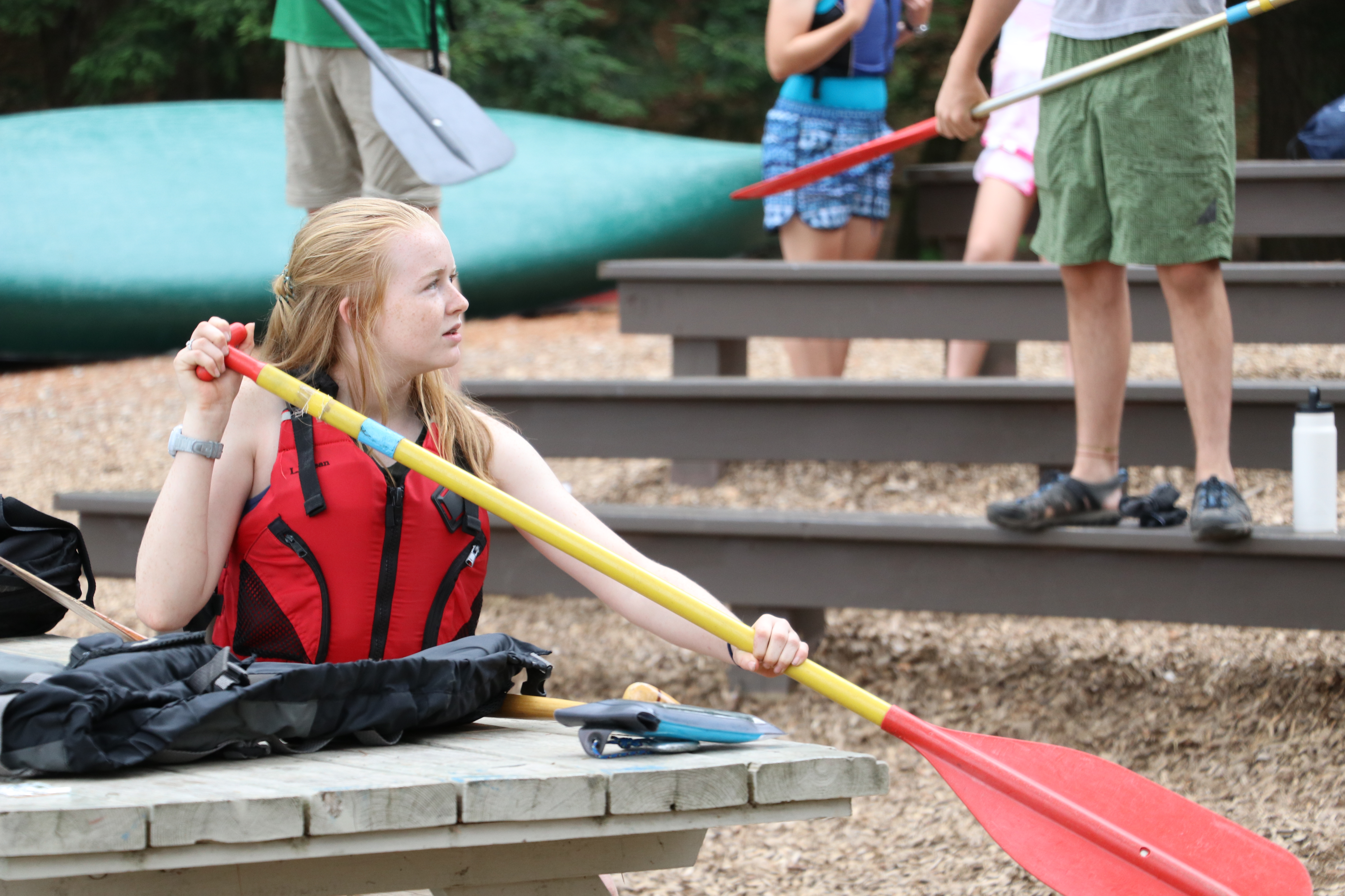 Laura Howe demonstrates proper paddle technique to the class