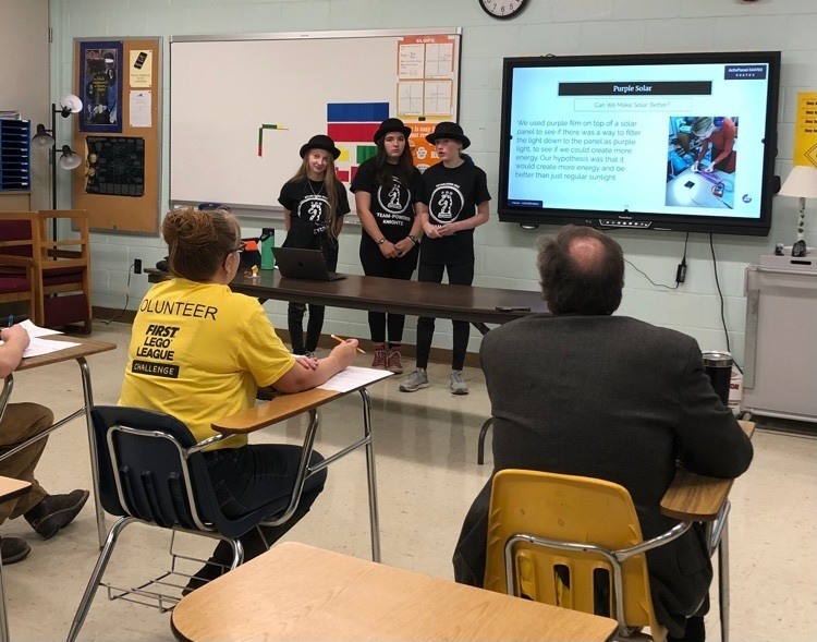 Members of the STEAM Powered Knights present their innovation project that focused on transforming PFAS contaminated areas into solar farms.