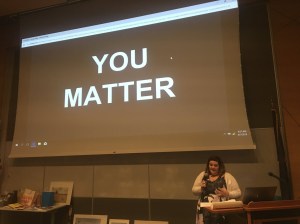 Teacher presenting with overhead slide that reads "you matter"