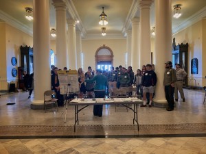 person presenting in front of a large audience