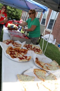 pizza pies all lined up ready to serve