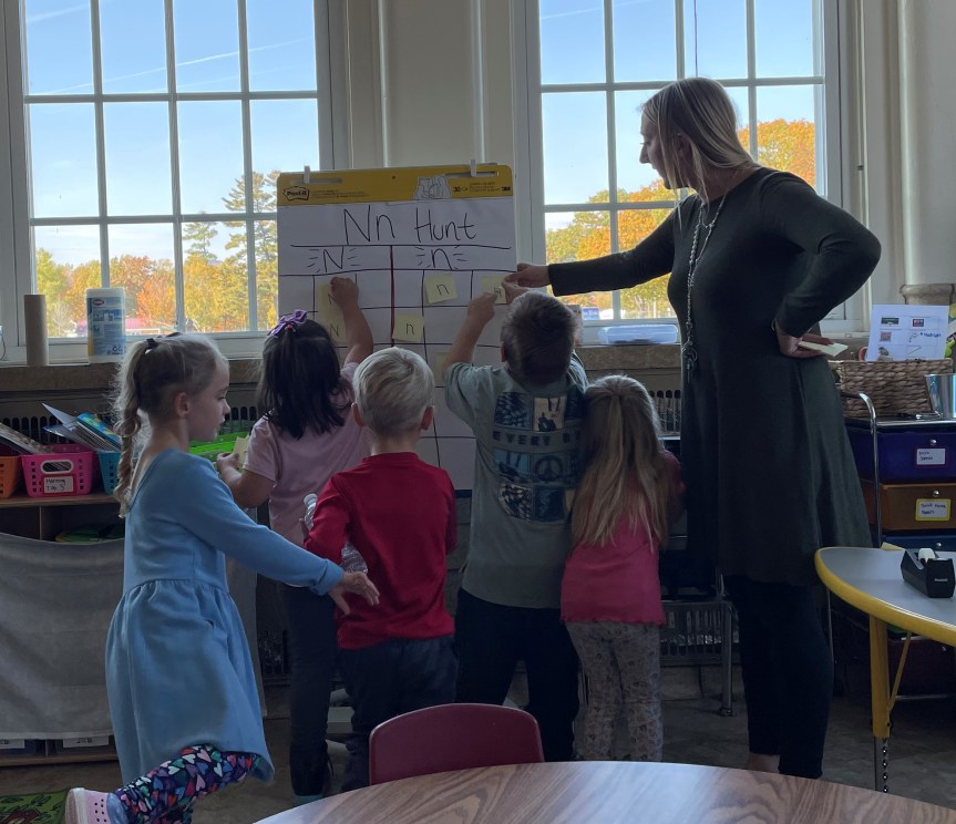 Greenville teacher, Allison Boulier, builds letter identification skills by having her class go on a letter hunt.