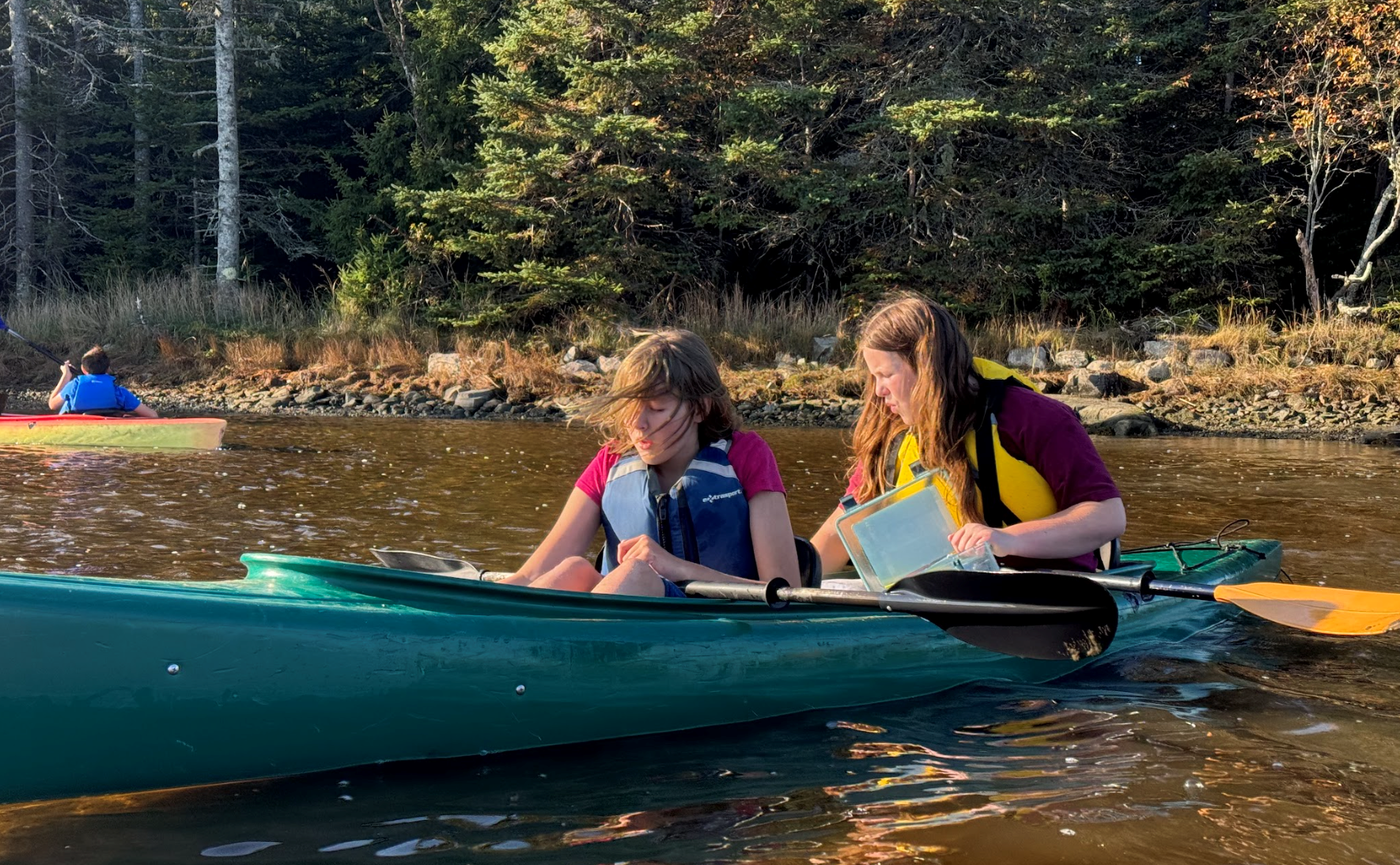 Students in a canoe in the water