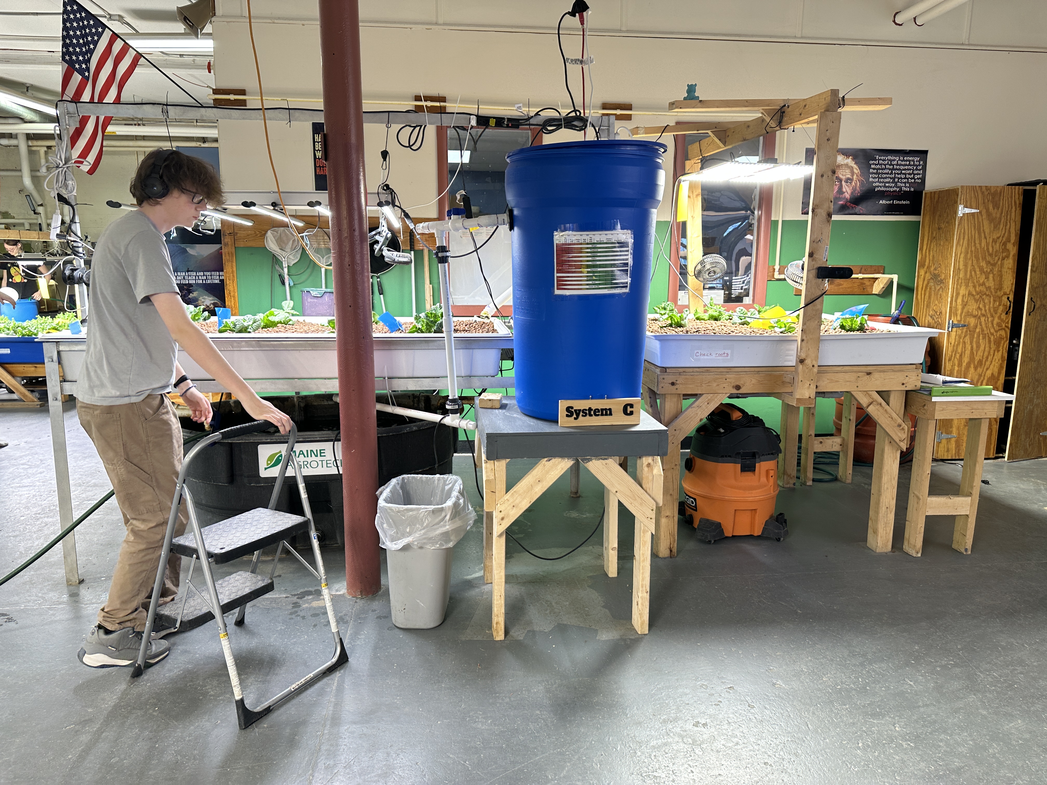 A student working on one of the aquaponics systems.