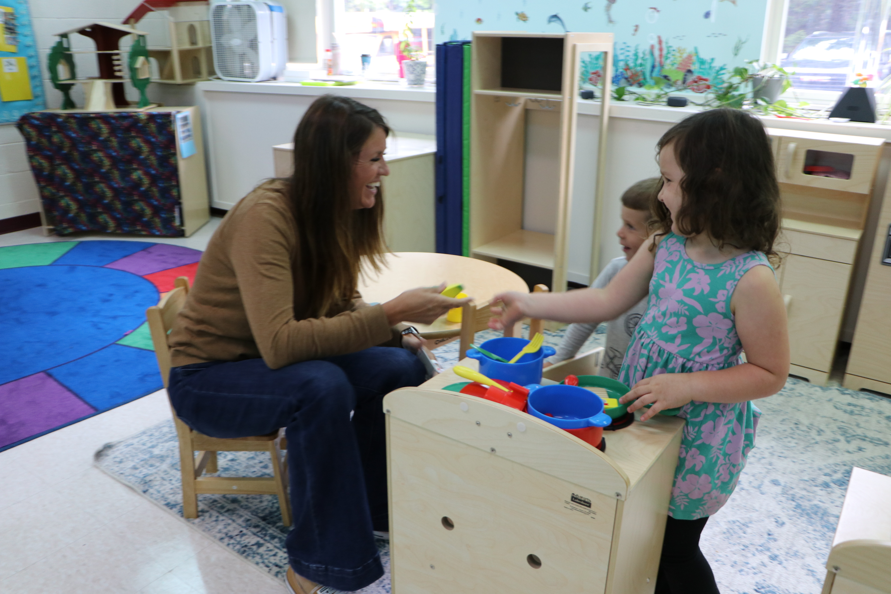 St. George Special Education Director Dr. Jessica Berry talking with students in the 3-K room