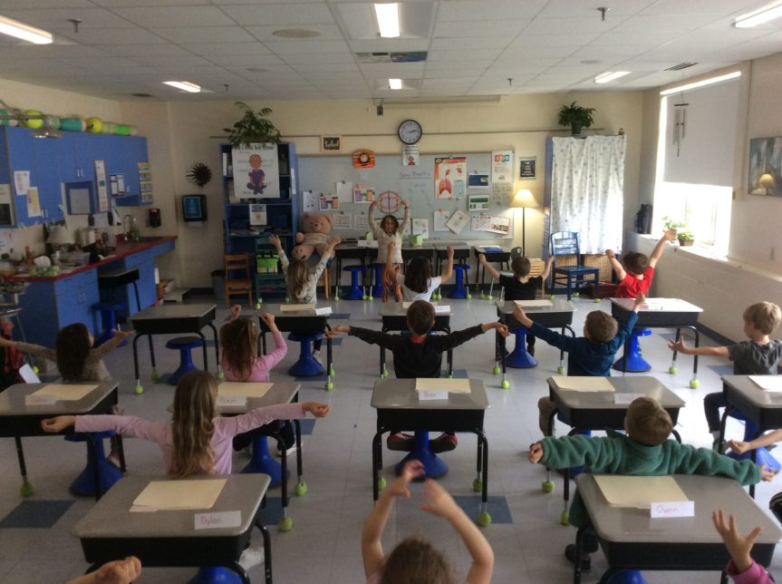 Kindergarten students doing deep breathing