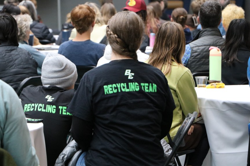 Student wearing t-shirt that says "recycling team " on the back