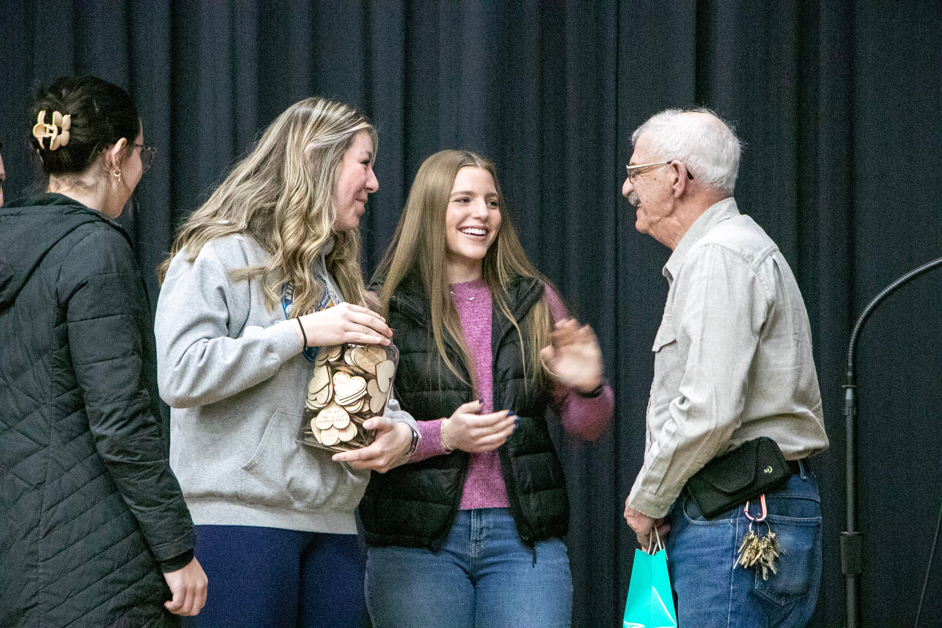 High school students honored Larry Plourde with a jar of wooden hearts with heartfelt messages. (Credit: Maine Department of Education)