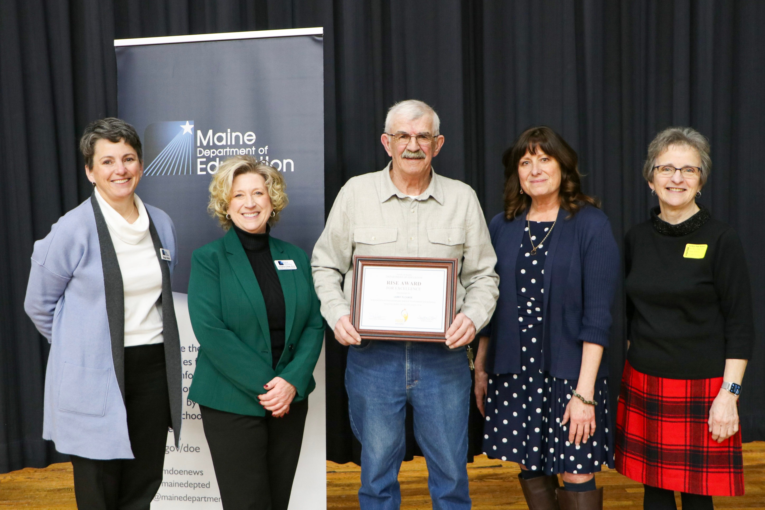 From left to right: Maine DOE Associate Commissioner of Public Education Megan Welter, Maine DOE Educator Excellence Coordinator Christina O'Neal, Caribou High School custodian Larry Plourde, Maine DOE Commissioner Pender Makin, Maine State Board of Education member Fern Desjardins (Credit: Maine Department of Education)
