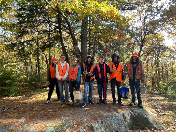 MSAD 15 ExCEL students and teacher Laura Fralich support their local community through trail work.