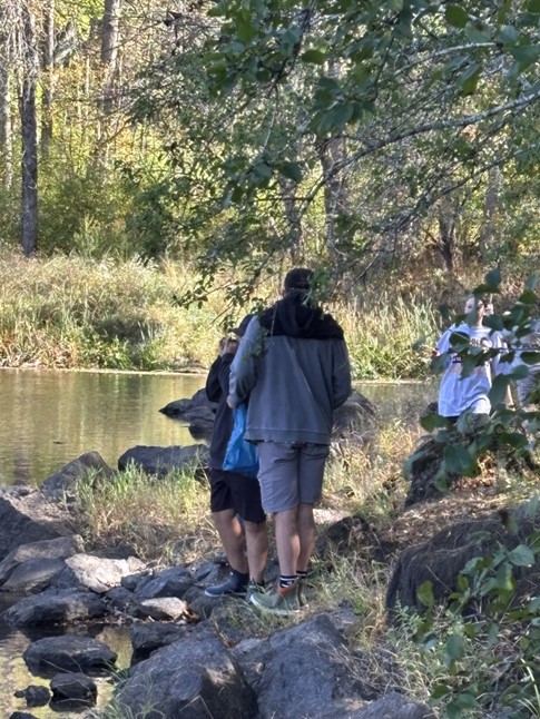 Students explore the river during their visit to Camden to observe a dam removal project