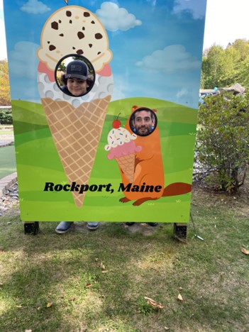 Lucas Brower, an educational technician, and student have some fun after a field trip into the community.