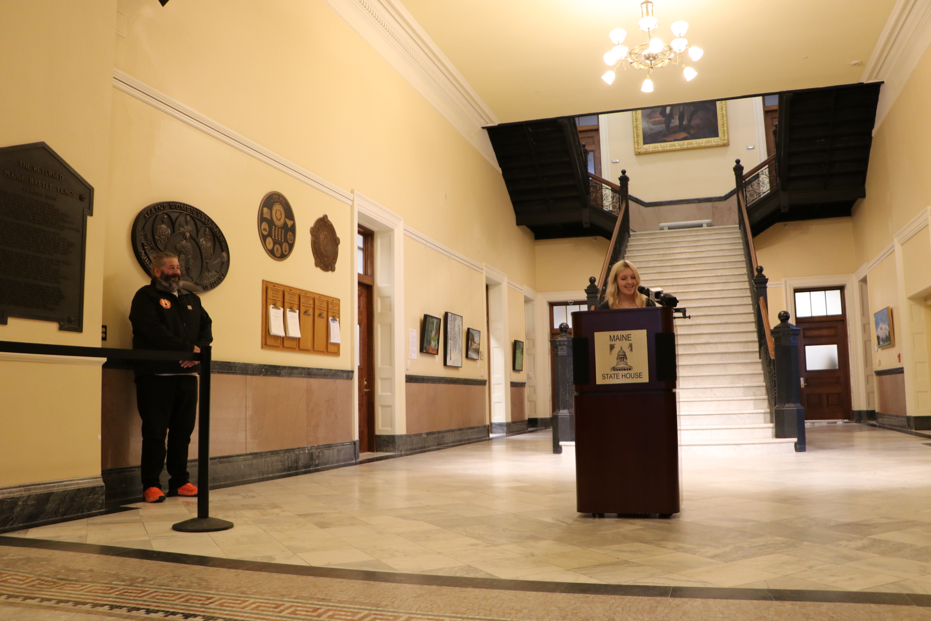 Brewer High School student Haleigh Pinkham talks about her ELO experience at Eastern Maine Emergency Veterinary Clinic as ELO Coordinator Kevin Napolillo looks on
